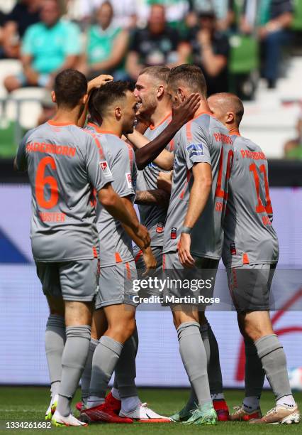 Felix Platte of SC Paderborn celebrates with team mates after scoring their side's first goal during the Second Bundesliga match between SV Werder...