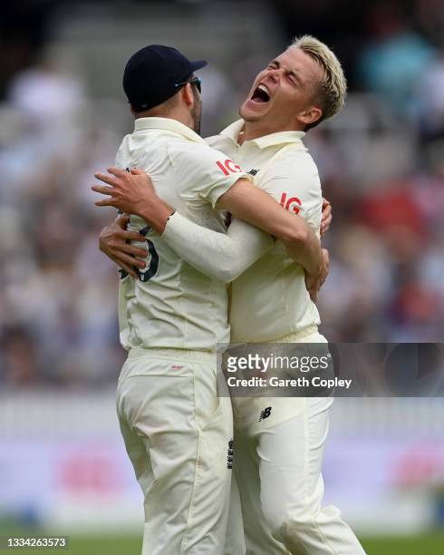 Sam Curran of England celebrates with Mark Wood after dismissing India captain Virat Kohli during day four of the Second LV= Insurance Test Match...