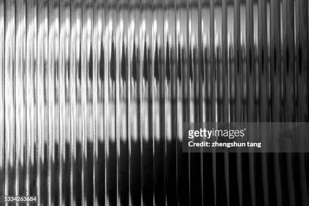 luminous lines on the glass. - glass material stock pictures, royalty-free photos & images