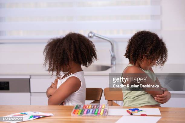 quarreled little girls. - students arguing stock pictures, royalty-free photos & images