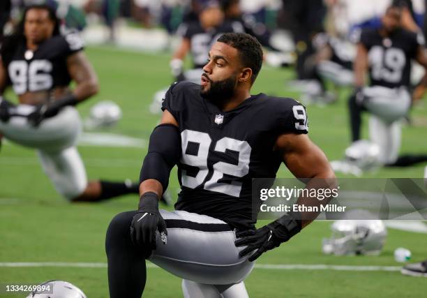 Defensive end Solomon Thomas of the Las Vegas Raiders stretches during warmups before a preseason game against the Seattle Seahawks at Allegiant...