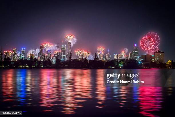 celebration fireworks over melbourne city skyline reflecting albert park lake - melbourne skyline stock pictures, royalty-free photos & images