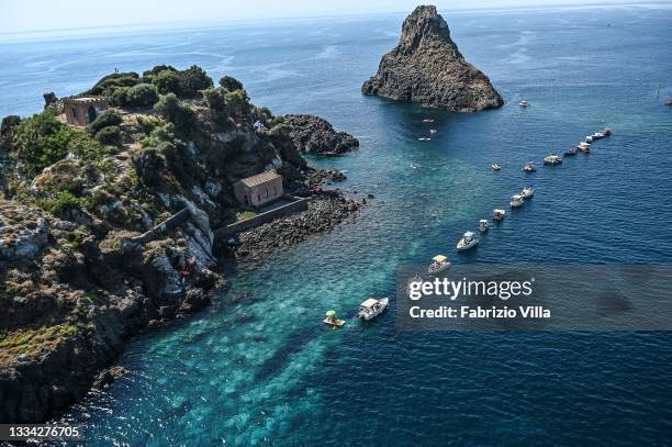 The Faraglioni of Acitrezza in an aerial view from the helicopter of the Coast Guard on the day of Ferragosto in the operation "safe sea" on August...