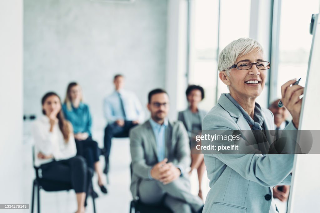 Group of business persons attending a business conference