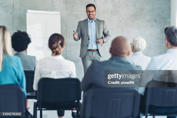 business presentation - male giving speech stock pictures, royalty-free photos & images