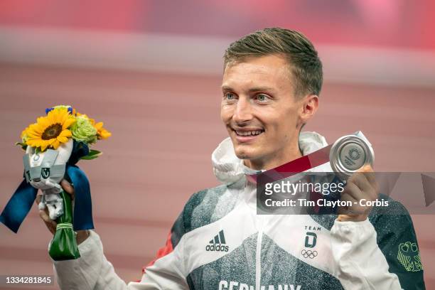 August 7: Jonathan Hilbert of Germany on the podium receiving his silver medal for the 50km walk for men during the Track and Field competition at...