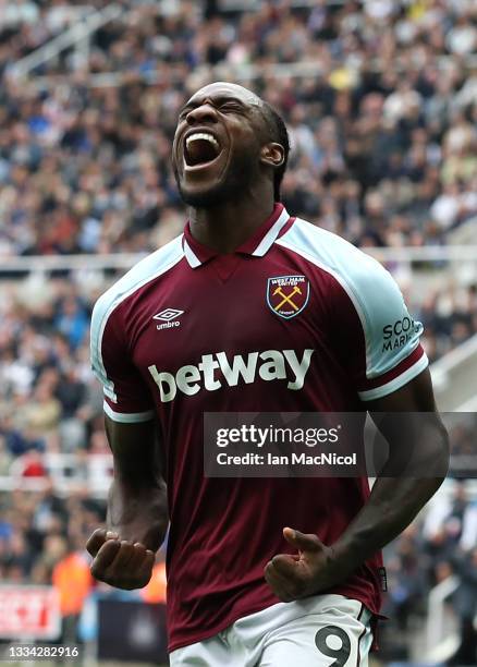 Michail Antonio of West Ham United celebrates after scoring their side's fourth goal during the Premier League match between Newcastle United and...