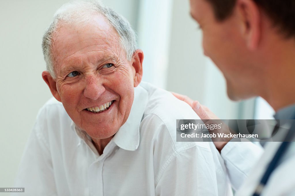 Male doctor discussing with his patient