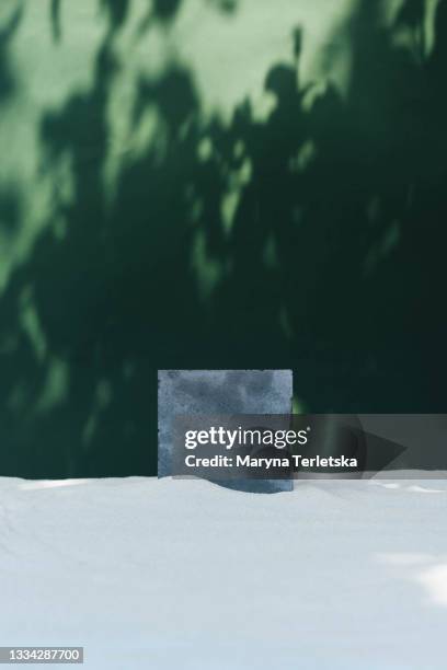 concrete podium with sand and tree shade. - solid perfume stock pictures, royalty-free photos & images