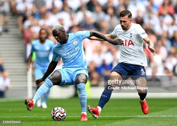 Benjamin Mendy of Manchester City battles for possession with Pierre-Emile Hojbjerg of Tottenham Hotspur during the Premier League match between...