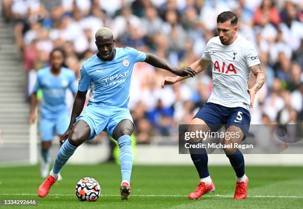 Benjamin Mendy of Manchester City battles for possession with Pierre-Emile Hojbjerg of Tottenham Hotspur during the Premier League match between...