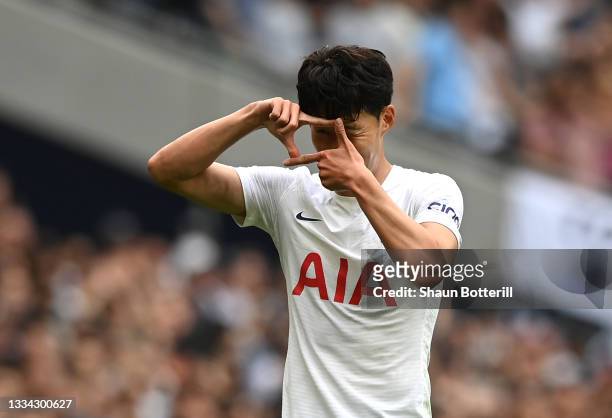 Heung-Min Son of Tottenham Hotspur celebrates after scoring their side's first goal during the Premier League match between Tottenham Hotspur and...