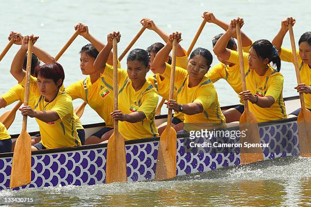 The Myanmar Women's 12 crew paddle during traditional boat racing on day nine of the 2011 Southeast Asian Games at Danau Cipule on November 19, 2011...