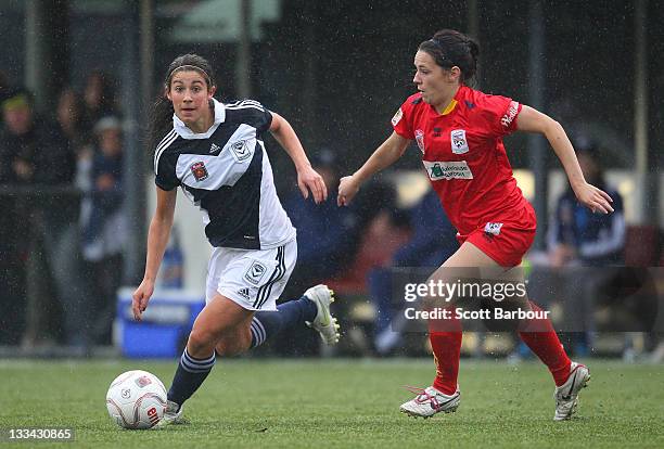 Stephanie Catley of the Victory and Donna Cockayne of United compete for the ball during the round five W-League between the Melbourne Victory and...