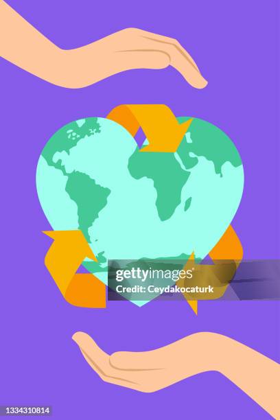 heart shaped earth globe with recycle symbol between hands. save the planet concept - alternative lifestyle stock illustrations