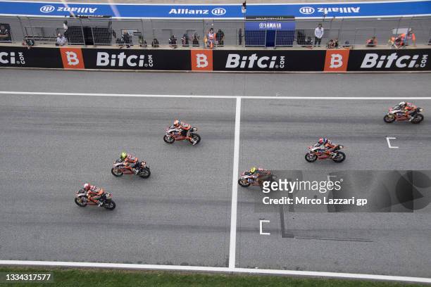 The Red Bull MotoGP Rookies Cup riders start from the grid during the Red Bull MotoGP Rookies Cup race 2 during the MotoGP of Austria - Race at Red...