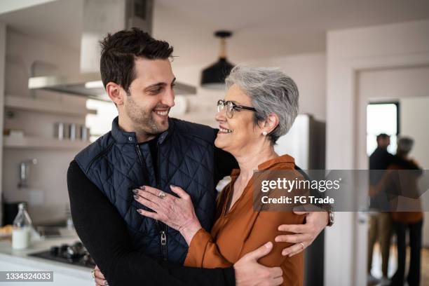 mother and son together at home - happy mothers day stock pictures, royalty-free photos & images