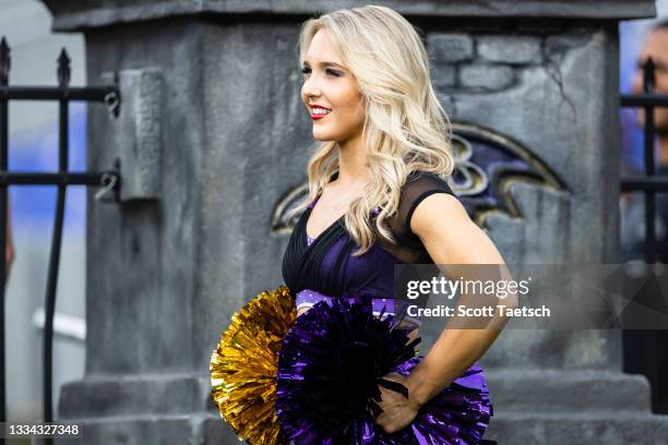 Cheerleader looks on before a preseason game between the Baltimore Ravens and the New Orleans Saints at M&T Bank Stadium on August 14, 2021 in...