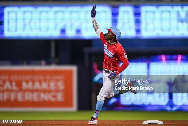 Jazz Chisholm Jr. #2 of the Miami Marlins hold up the peace sign while running the bases after hitting a solo homerun in the sixth inning against the...