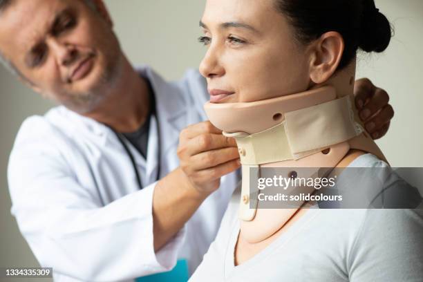 woman with neck brace - cervical collar stock pictures, royalty-free photos & images