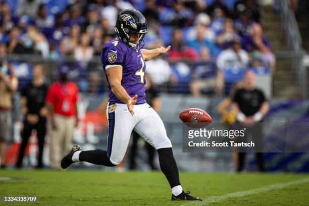 Sam Koch of the Baltimore Ravens punts during the first half of a preseason game against the New Orleans Saints at M&T Bank Stadium on August 14,...