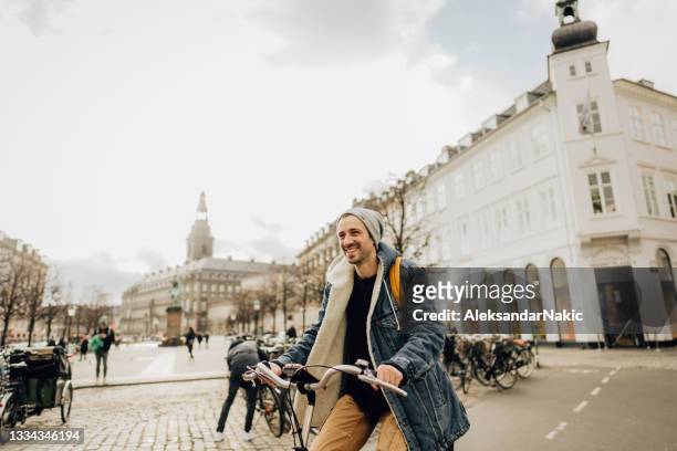 riding a bike around the city - copenhagen cycling stock pictures, royalty-free photos & images