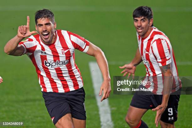 Fabian Noguera of Estudiantes celebrates after scoring the first goal of his team with teammate Leandro Diaz during a match between Estudiantes and...