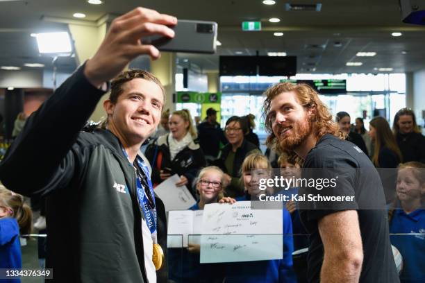 Men's Rowing 8 Gold medal winners Michael Brake and Shaun Kirkham pose with fans during a welcome home ceremony for the New Zealand Tokyo 2020...