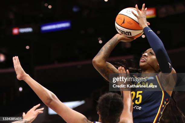 Tiffany Mitchell of the Indiana Fever shoots as Kristi Toliver of the Los Angeles Sparks defends during the second half of a game at Staples Center...