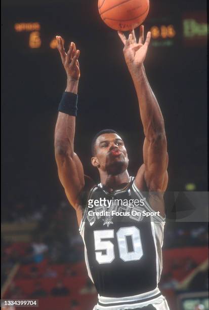 David Robinson of the San Antonio Spurs shoots a foul shot against the New York Knicks during an NBA basketball game circa 1990 at Madison Square...