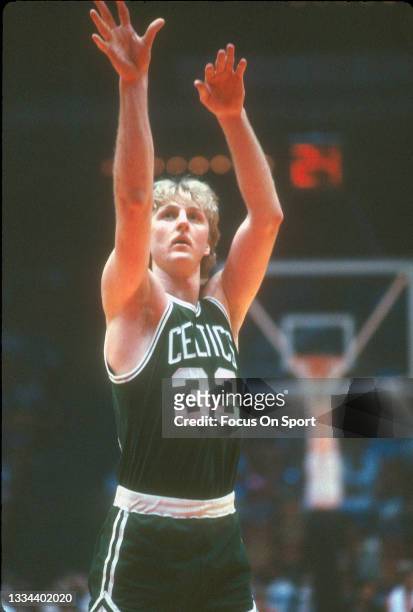 Larry Bird of the Boston Celtics shoots a foul shot against the Houston Rockets during an NBA basketball game circa 1981 at The Summit in Houston,...