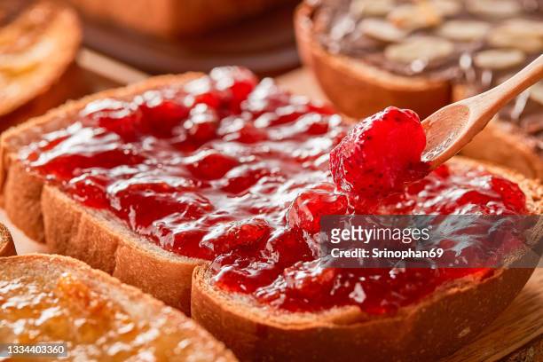toast with jam snack menu - peanut butter and jelly sandwich stockfoto's en -beelden