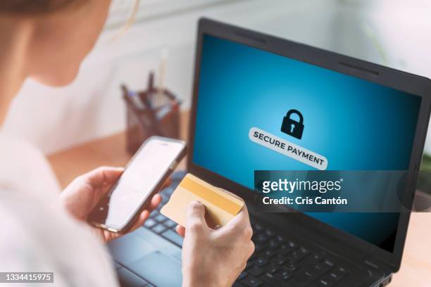 woman making online secure payment on computer with mockup - credit card mockup stock pictures, royalty-free photos & images