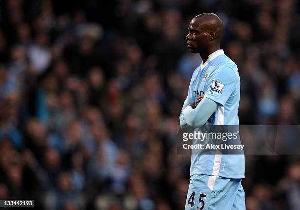 Mario Balotelli of Manchester City looks on after scoring the opening goal during the Barclays Premier League match between Manchester City and...