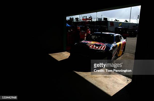 Kasey Kahne, driver of the Red Bull Toyota, drives in the garage area during practice for the NASCAR Sprint Cup Series Ford 400 at Homestead-Miami...