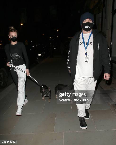 Damien Hirst and Sophie Cannell enjoy dinner at Scott's restaurant in Mayfair with their dogs on August 13, 2021 in London, England.