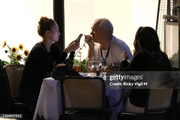 Damien Hirst and Sophie Cannell enjoy dinner at Scott's restaurant in Mayfair with their dogs on August 13, 2021 in London, England.