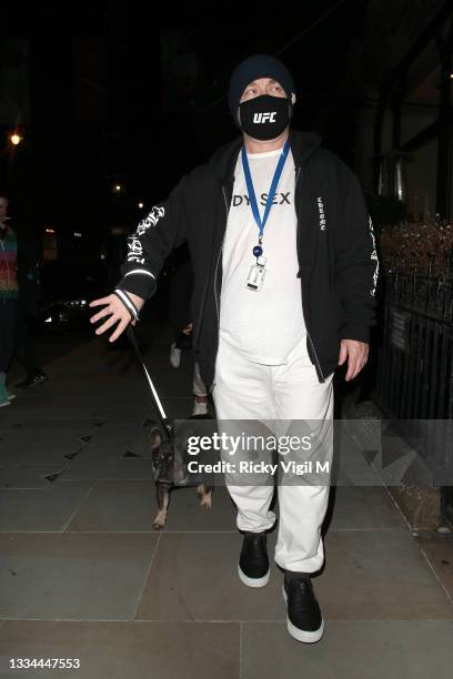 Damien Hirst and Sophie Cannell enjoys dinner at Scott's restaurant in Mayfair with their dogs on August 13, 2021 in London, England.