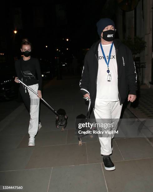 Damien Hirst and Sophie Cannell enjoy dinner at Scott's restaurant in Mayfair with their dogs on August 13, 2021 in London, England.