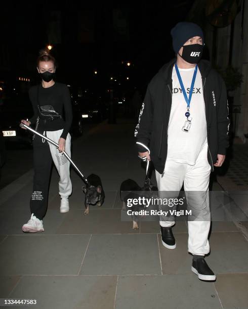 Damien Hirst and Sophie Cannell enjoy dinner at Scott's restaurant in Mayfair with their dogs on August 13, 2021 in London, England.