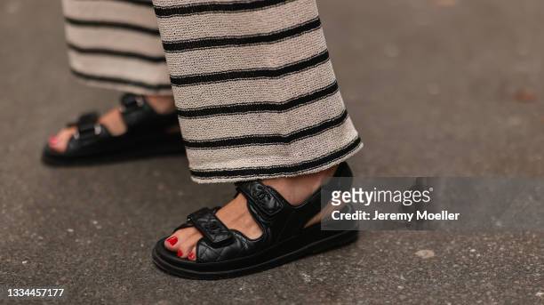 Ira Meindl wearing black Chanel sandals and Zara pants on August