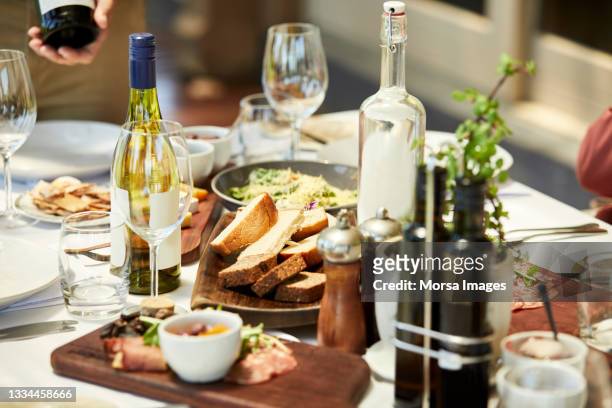 high angle view of food and drink in restaurant - dining overlooking water stockfoto's en -beelden