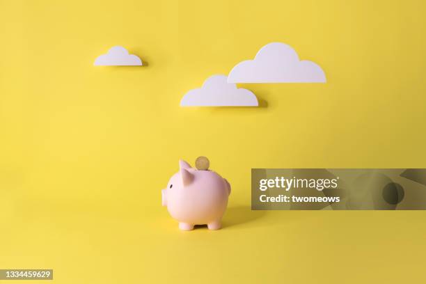 one piggy bank on yellow sky background. - 貯金箱 ストックフォトと画像