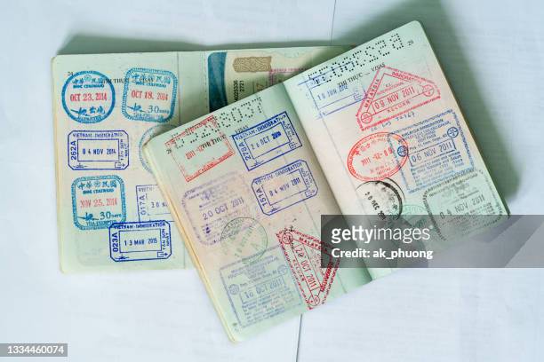 stamp on vietnamese passport - emigration and immigration foto e immagini stock