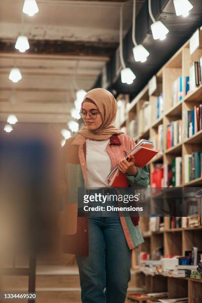 islamic student at library - arabic literature stock pictures, royalty-free photos & images
