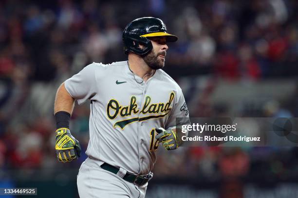 Mitch Moreland of the Oakland Athletics runs the bases after a seventh inning home run against the Texas Rangers at Globe Life Field on August 14,...