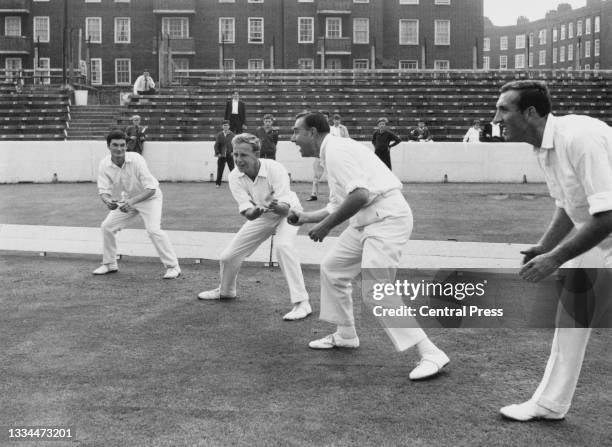 Wicket- keeper Alan Knott, Derek Underwood, Colin Cowdrey and Geoffrey Arnold of England undertake catching practice before the 3rd Test Match...