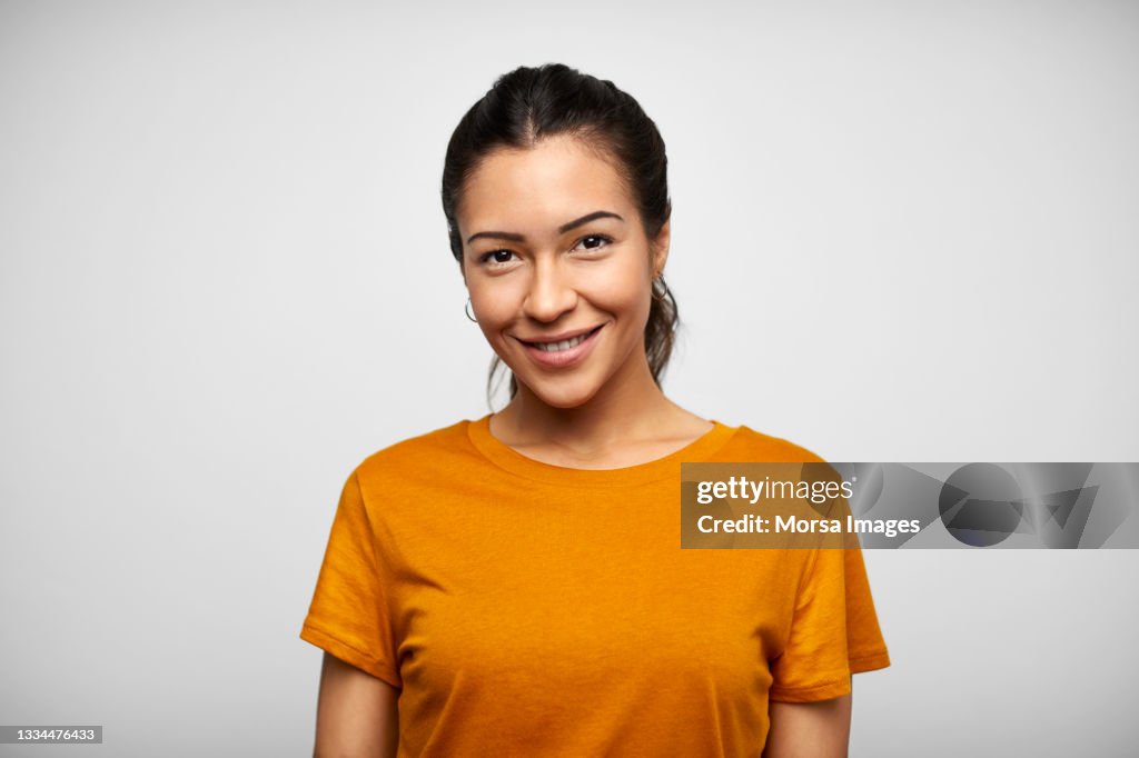 Happy Hispanic Woman Against White Background