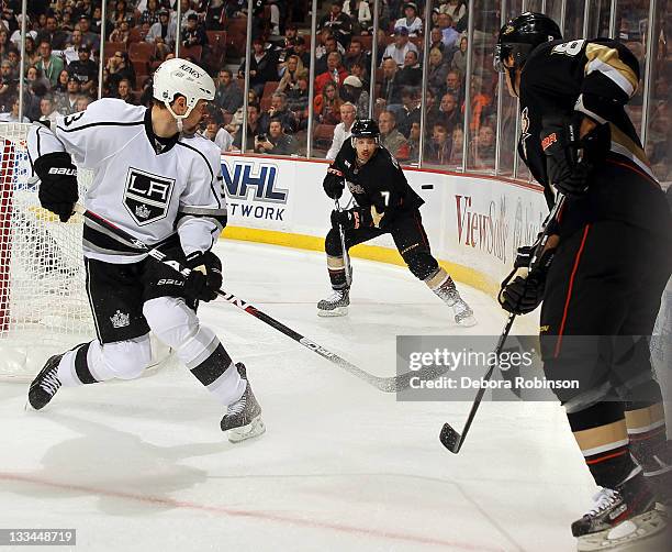 Andrew Cogliano of the Anaheim Ducks passes the puck past Willie Mitchell of the Los Angeles Kings during the game on November 17, 2011 at Honda...