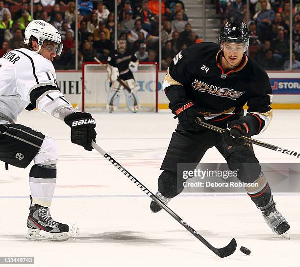 Luca Sbisa of the Anaheim Ducks defends against Anze Kopitar of the Los Angeles Kings during the game on November 17, 2011 at Honda Center in...